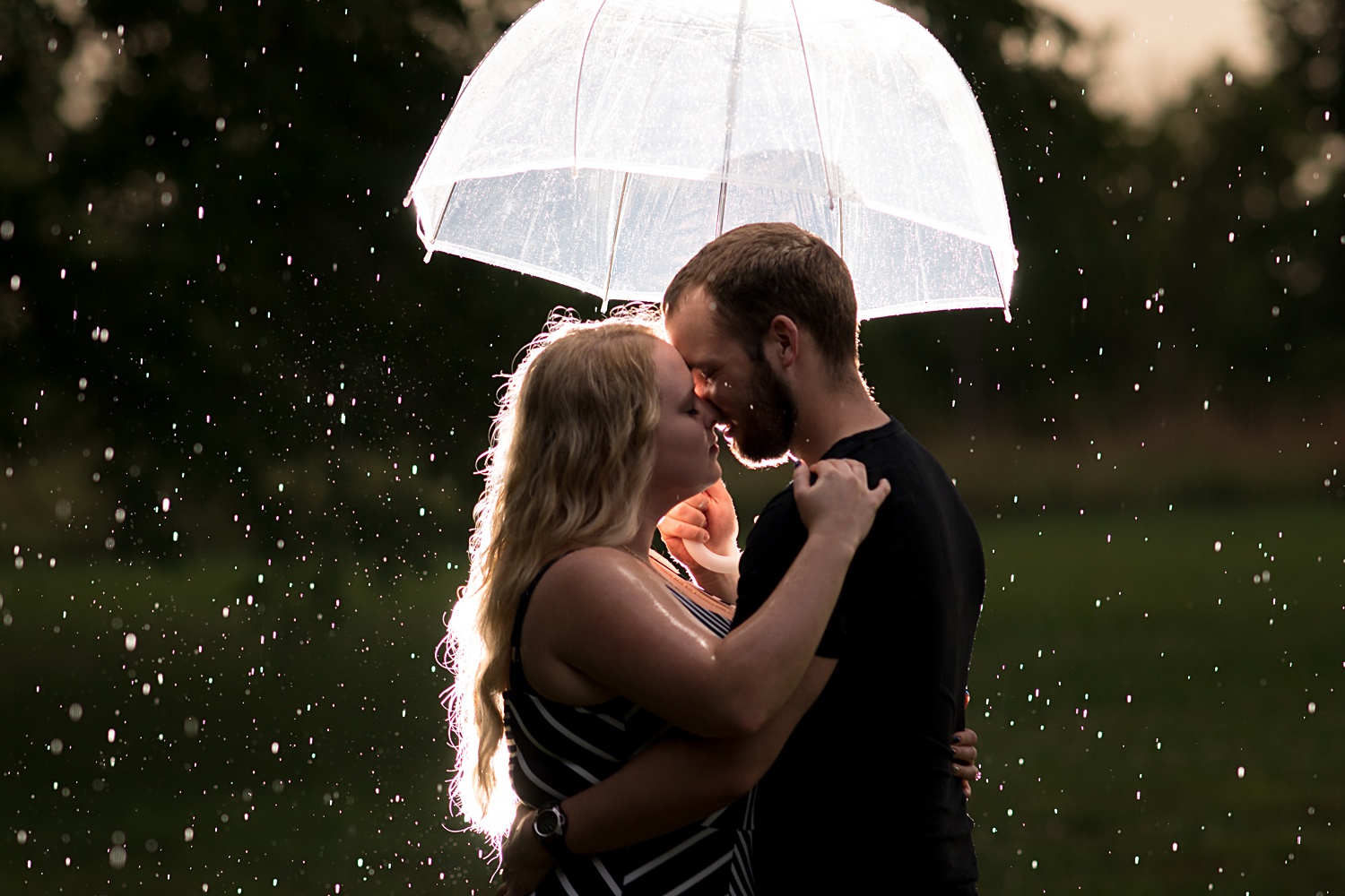 Umbrella photo in the rain for engagement session Emily Lynn Photography