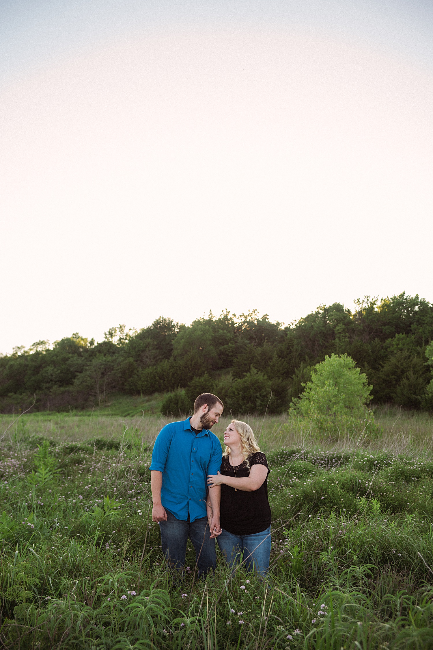 Photos of couples in the fields for their engagement photos Emily Lynn Photography