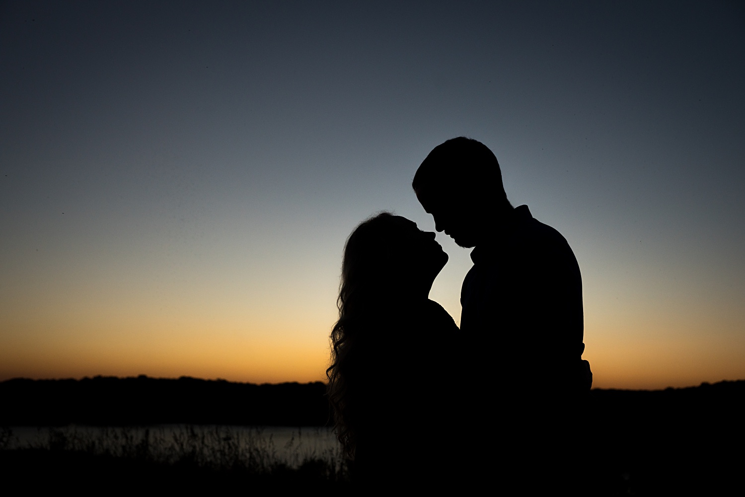 Silhouette engagement photo at sunset
