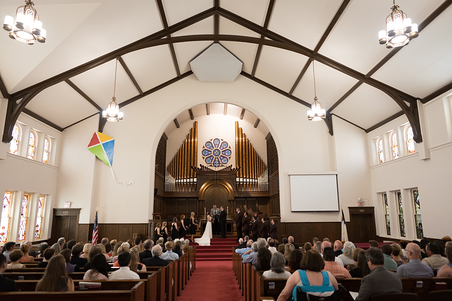 Wedding ceremony images at United Methodist Church in Lawrence, KS
