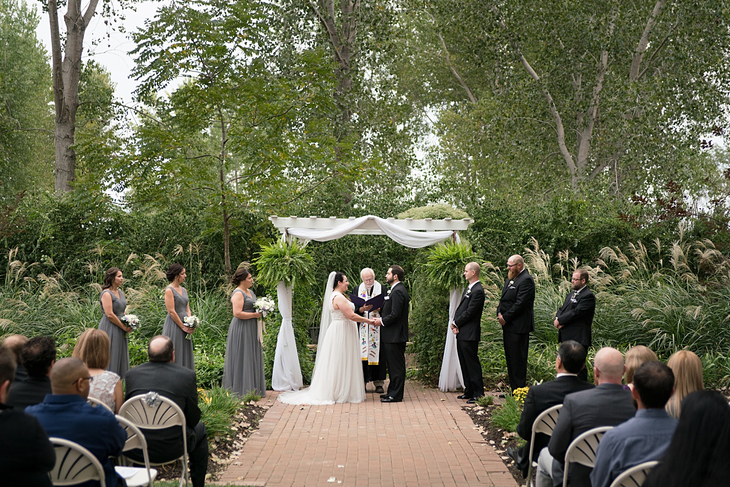 Wedding Ceremony in garden. VVI Wedding - Victoria Veranda Country Inn Wedding Photos- Lawrence, KS-Wedding-Photographer-Emily-Lynn-Photography