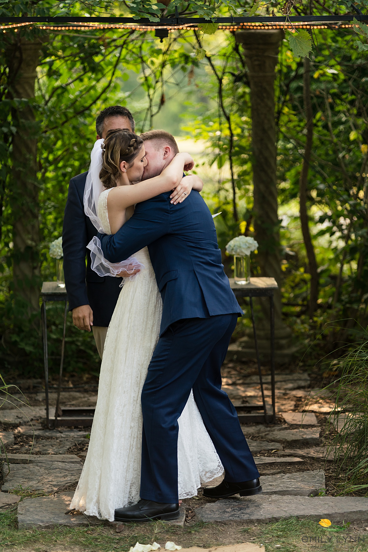 First kiss photo during the ceremony. Wedding-Photos-at-Enchanted-Acres-KC-Wedding-Photographer-Emily-Lynn-Photography.