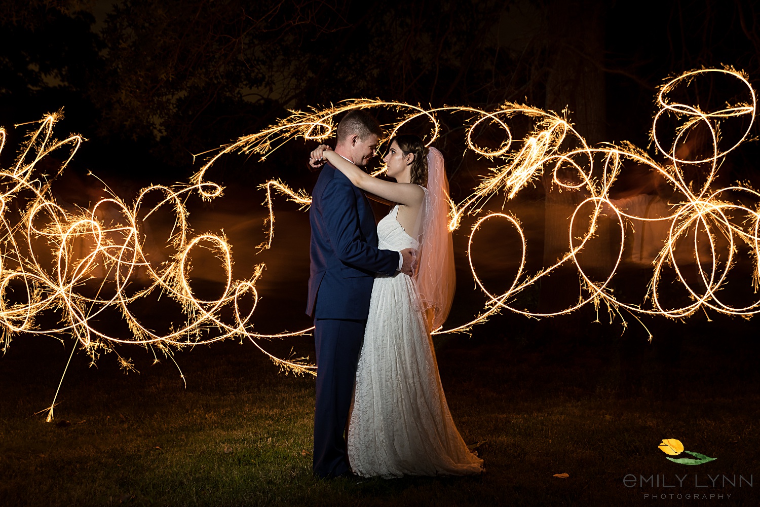 Light play with sparklers. Wedding-Photos-at-Enchanted-Acres-KC-Wedding-Photographer-Emily-Lynn-Photography.