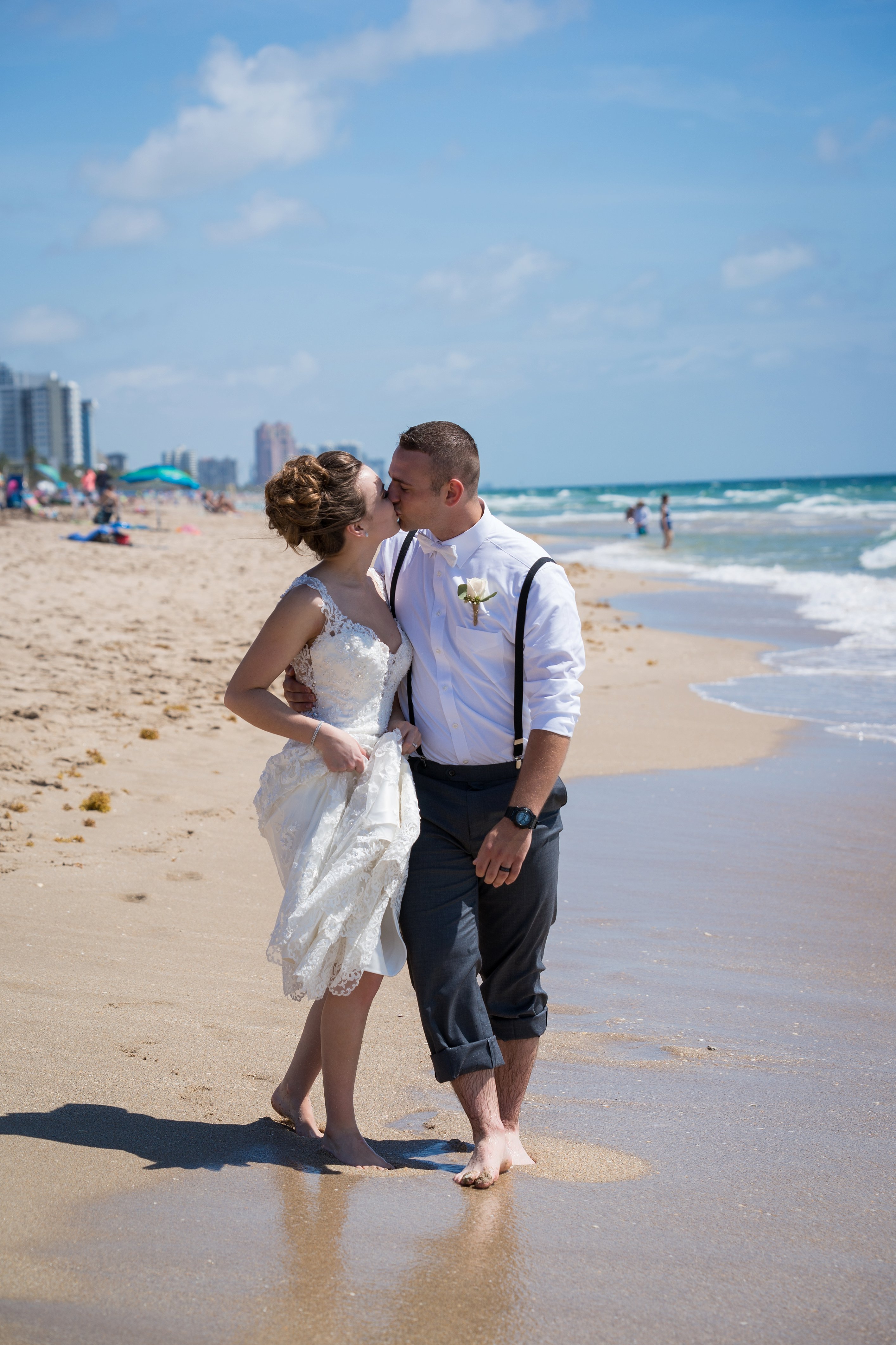 kissing beach wedding photo