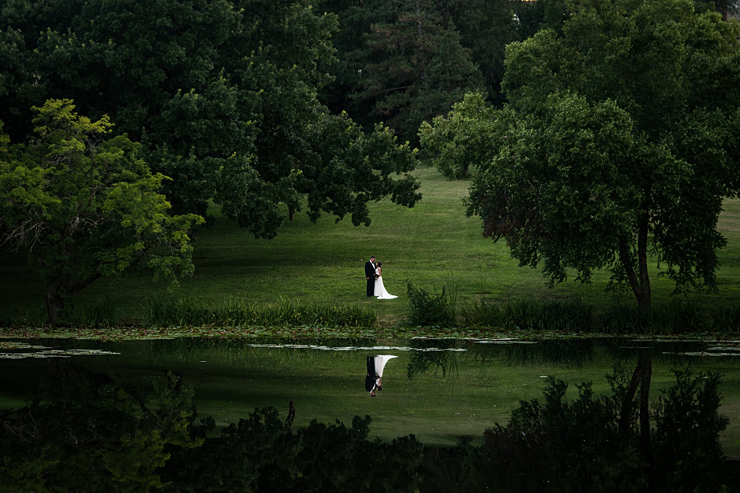 Wedding images of couple at Potter's Lake in Lawrence, KS at KU's campus